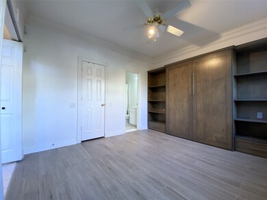 The first bedroom offers a private bathroom. Beyond the closed door on the left is a walk-in closet.