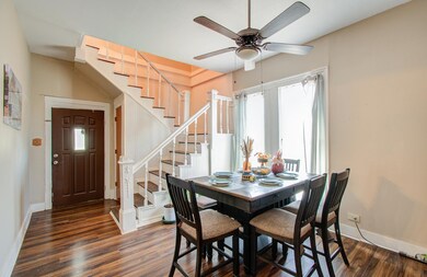 Bright dining area with modern flooring.