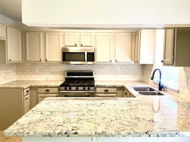 Granite counter tops and extended bar. New travert