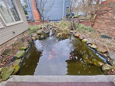 Goldfish/Koi pond with new pump & waterfall fountain at front entrance