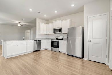 Whirlpool kitchen appliances and granite counterto