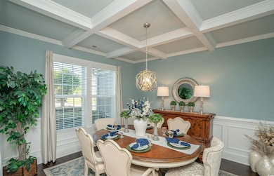Dining space with beamed ceiling, dark wood-style 