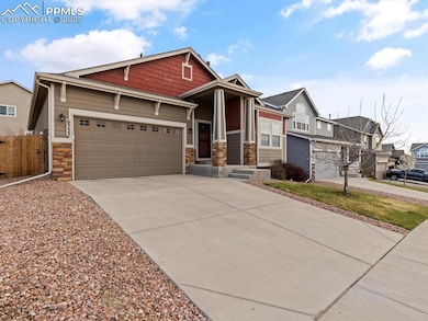 Craftsman-style home featuring a garage, fence, st