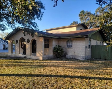 View of front of house with brick siding and covered porch
