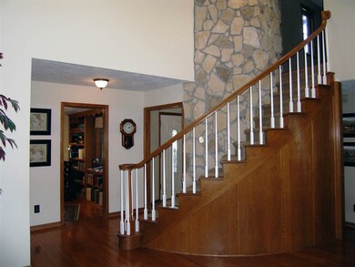 is but one of two stairs to upper level from main 