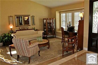 Step down to the lovely living room.