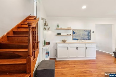 Entry with Side Staircase and Coat Closet