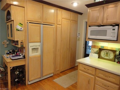 Refrigerator, pantry, washer & dryer.
