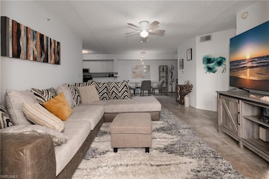Living room featuring a textured ceiling and ceili