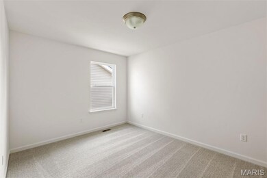 Unfurnished room featuring carpet flooring and baseboards