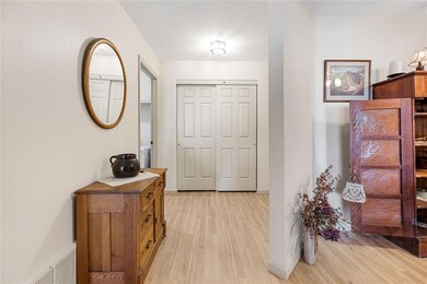Entry door opens onto vinyl floor for easy mainten