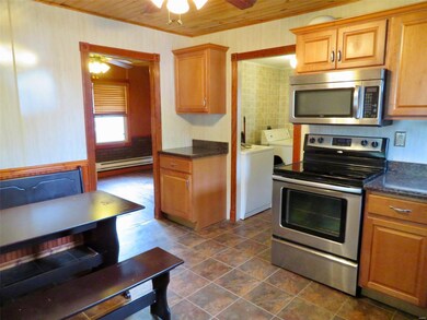 Corner dining set, laundry room off kitchen