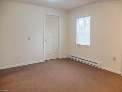 The dining room with new carpet is open to the liv