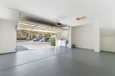 Garage featuring washing machine and dryer
