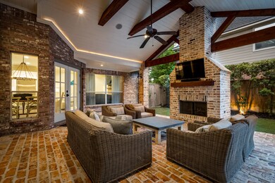The covered patio exudes warmth and elegance, providing a cozy retreat for outdoor relaxation and entertaining.