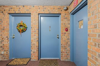 Door to the unit is in the center of the photo