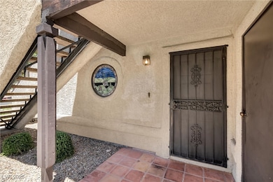 Doorway to property featuring stucco siding