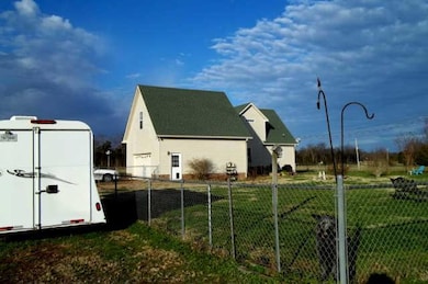 The backyard of home is fenced and has a large aggregate patio .