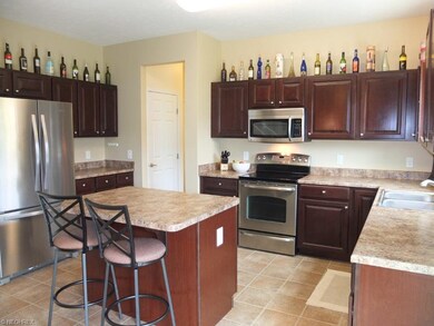 Spacious kitchen with center island and pantry.