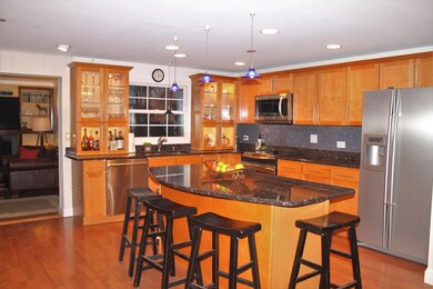 Open layout kitchen equipped with massive island a