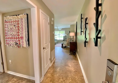 Hallway with light tile patterned floors