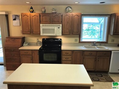 Oak cabinets throughout.  The island is movable. K