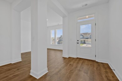 Sunny foyer and study.
