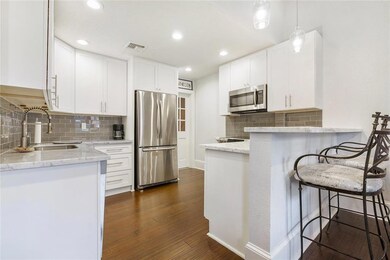 Kitchen has quartz counter tops, SS appliances, gl
