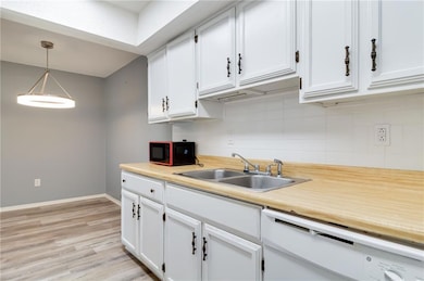 Kitchen view with dishwasher/microwave