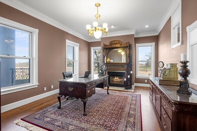 Home office featuring a fireplace with flush hear