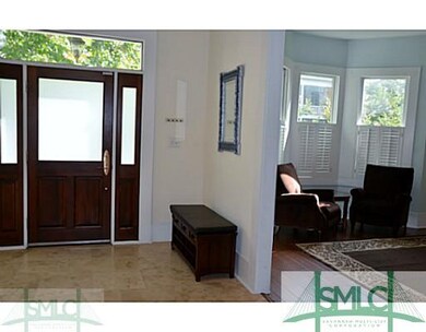 Foyer leads into a welcoming living room.