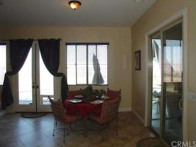 Travertine tile in the sunny breakfast nook!