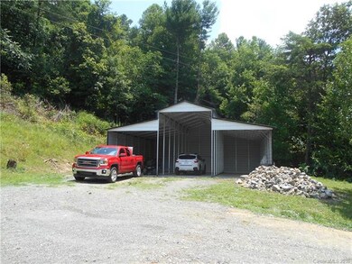 Massive 36' x 36' open front garage w/ lighting an