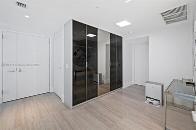 floor to ceiling custom wall shelving and storage entry