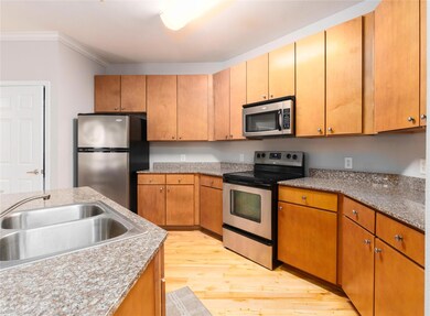 Kitchen featuring appliances with stainless steel