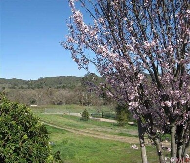 Level acreage below with room for horses, barn or 