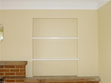 Shelving on either side of the fireplace.  Sweet d