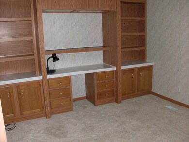 Den/Office w/blt-in cabinetry and desk