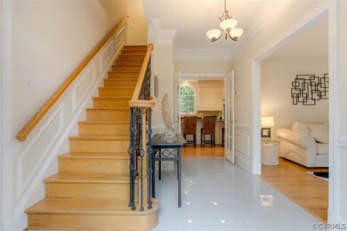 Bright Foyer.  Oak Stairs with Iron balusters