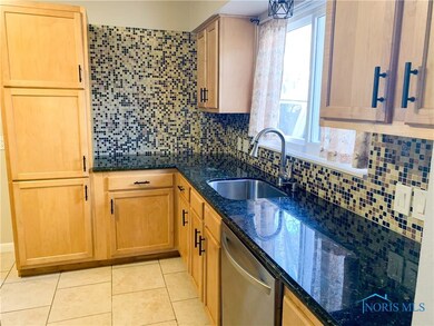 Remodeled Kitchen with Granite Counters and Tile F