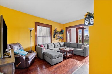 Living room featuring dark hardwood floors