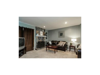 The sharp slate tile dresses up this fireplace as 