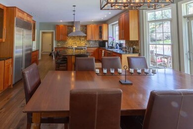 Dine in Kitchen area with sliding glass door leadi