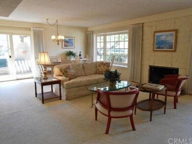 Living room and dining area have patio view.
