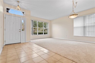 Formal Living / Dining combination is flooded with light. Brand-new carpeting.