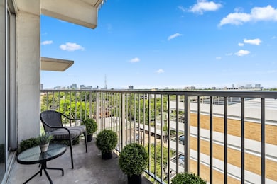 Balcony view facing south toward the lush greenery