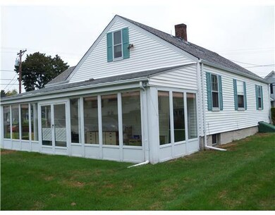 Exterior Back. Closed in Patio - Includes screens