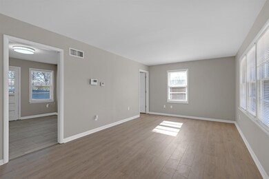 Unfurnished room with light hardwood / wood-style 