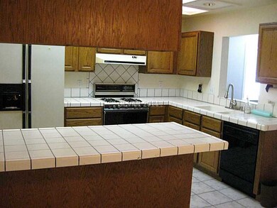 Kitchen. Breakfast bar with cabinets above