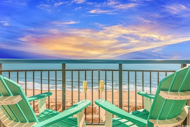Balcony with a water view and a beach view